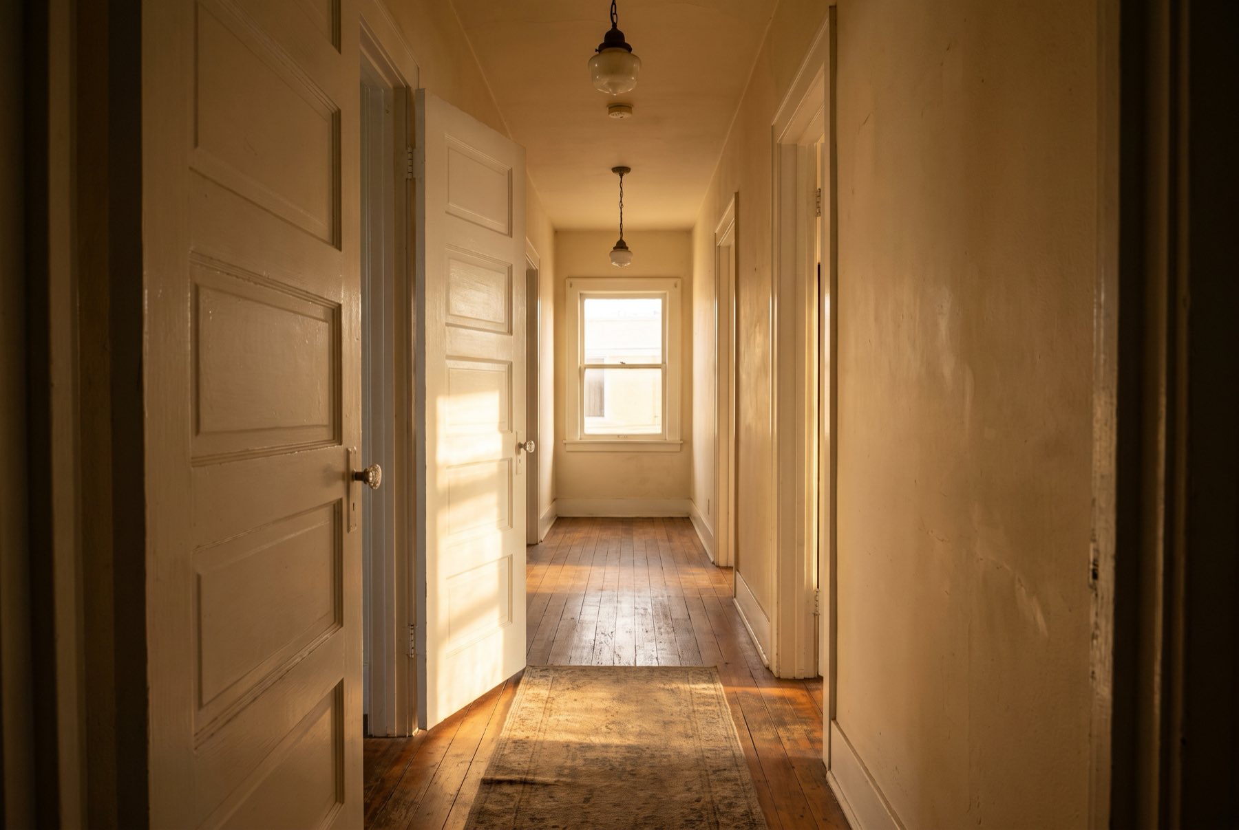 A freshly painted door standing ajar in an older Los Angeles hallway